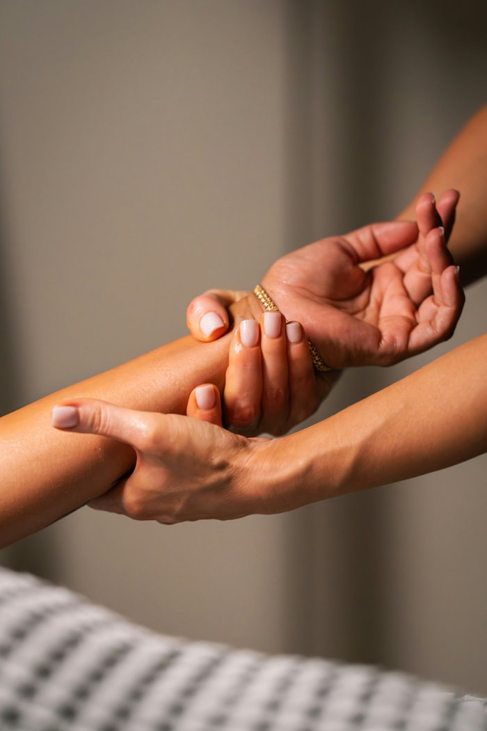 Hands during a massage therapy session