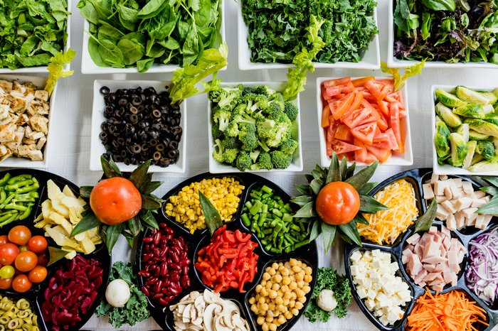 Assortment of fresh vegetables and salad toppings